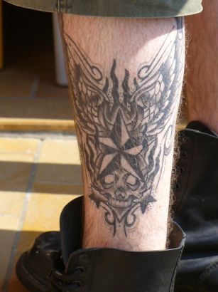 Scull Tattoo On Leg